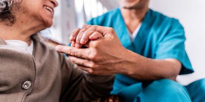 healthcare professional providing compassionate and supportive care to an elderly woman