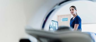 Hand holding a healthcare cross represented value based care